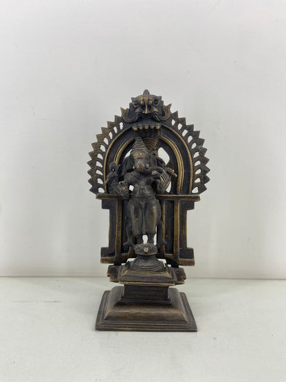 Brass standing Ganesha with detachable Prabhavali